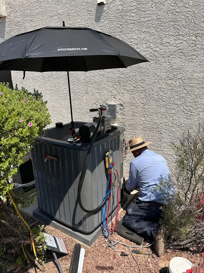 HVAC technician performing outdoor AC maintenance in Seneca Falls