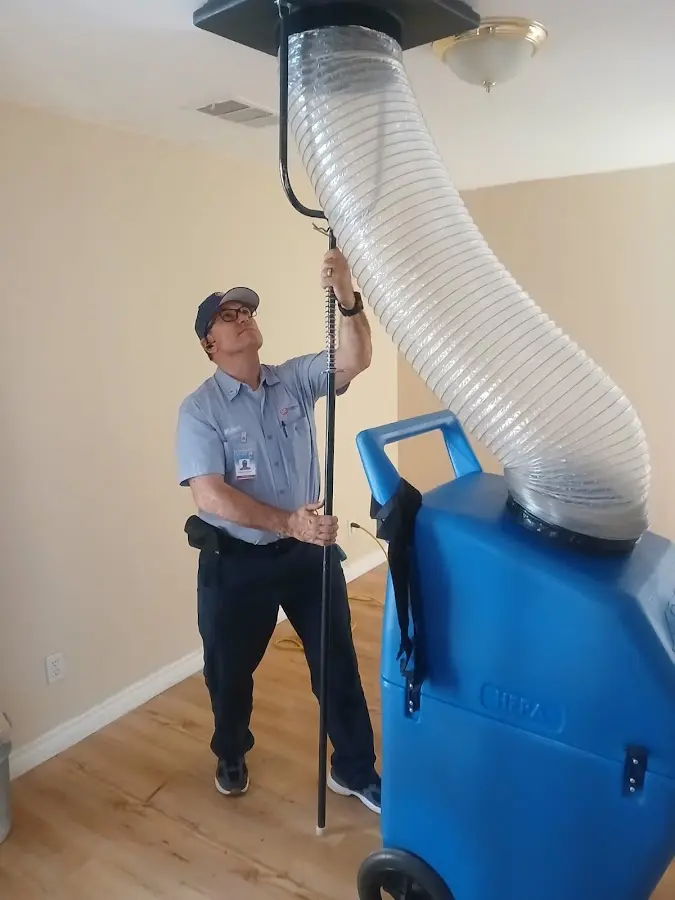 Furnace Tune-Up technician using HEPA equipment in Seneca Falls